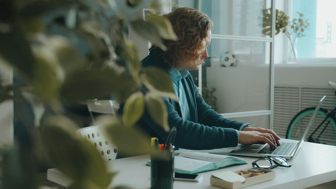 woman coding at home office