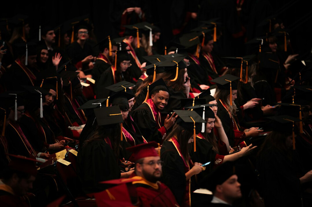 graduates celebrating achievement