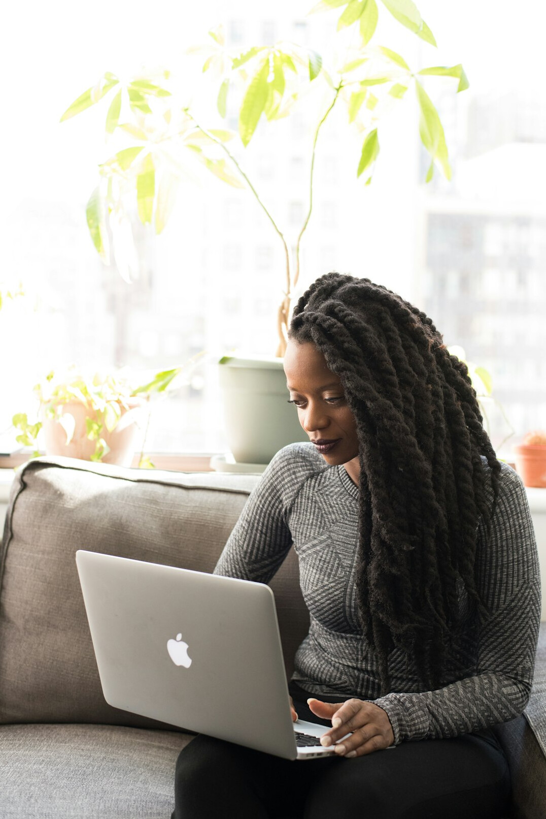 woman working remotely with laptop